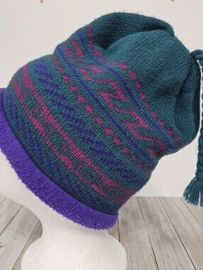 The Mews Knitted Fleece Lined Winter Beanie Hat with Braided Tassle Making Fun